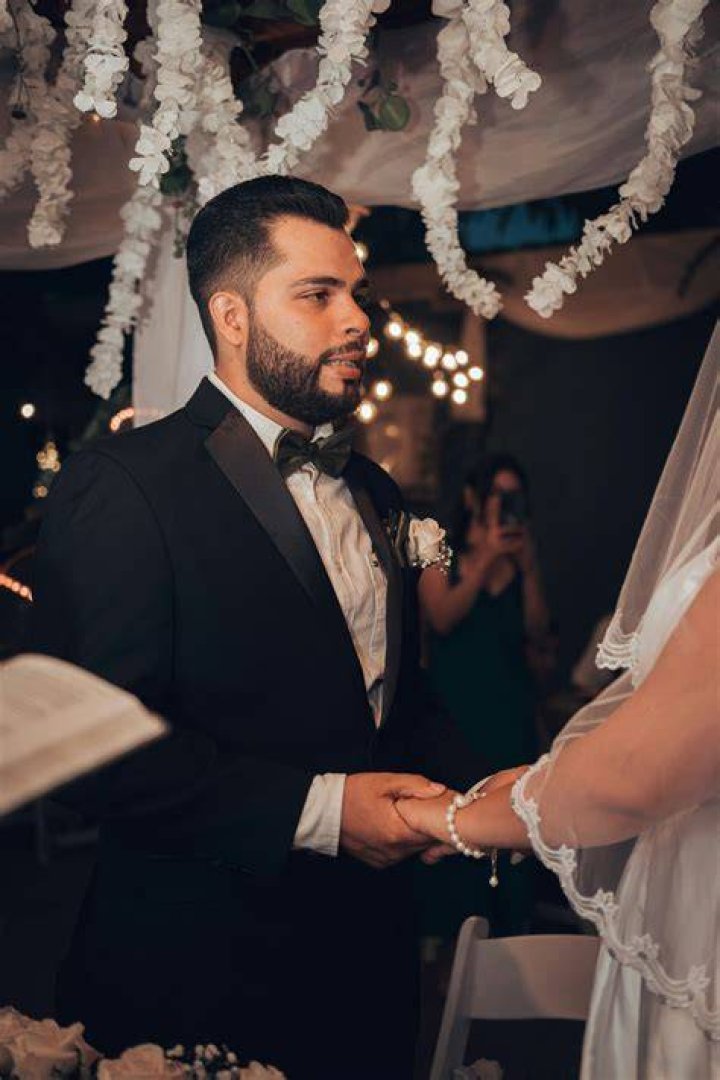 a man and woman standing next to each other