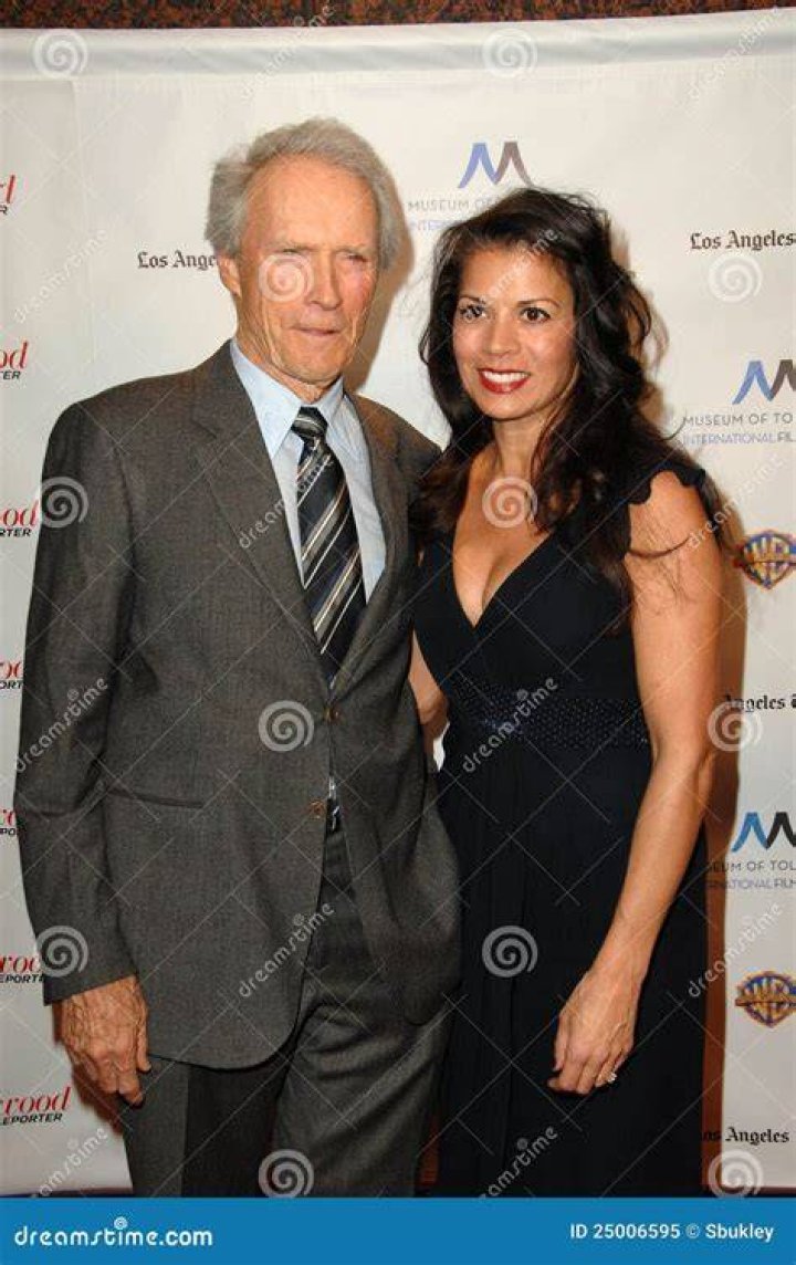 Clint Eastwood & Dina Ruiz Eastwood attend the 'Flags Of Our Fathers