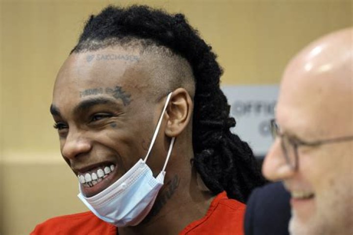 Is YNW Melly still in prison and what crimes is he accused of committing?