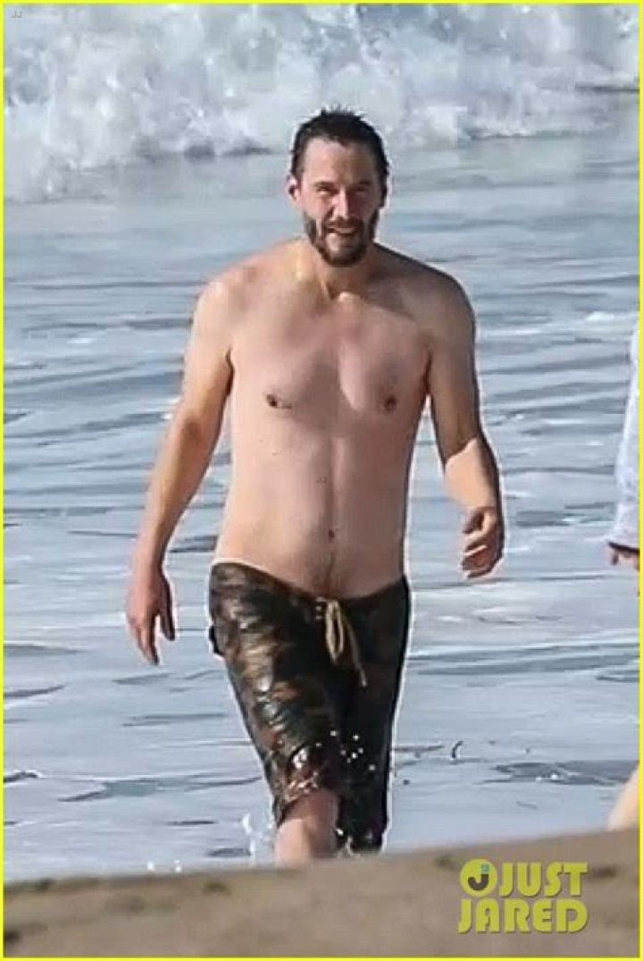 Shirtless Keanu Reeves Lounges on a Boat in Italy — See the Photos