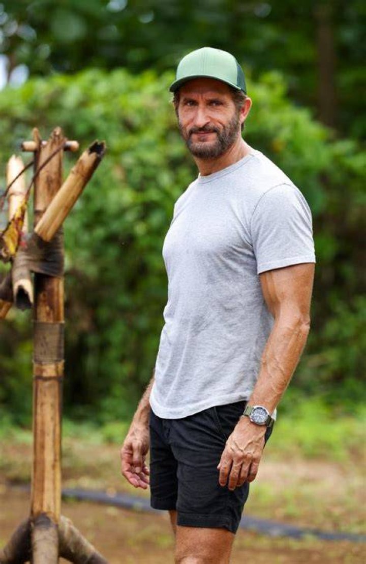 Survivor host Jonathan LaPaglia holds hands with his 22yearold