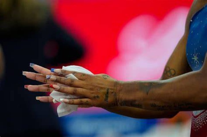 Why do gymnasts wear fake nails?